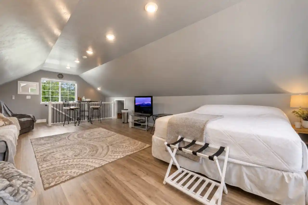 The Carriage Loft king bedroom with vaulted ceilings in Sheridan Wyoming vacation rental